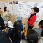 A student presenting her research