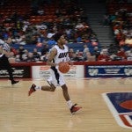 Gary Talton drives down the court