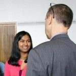 Young woman presents her research poster