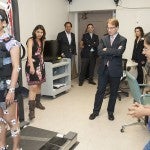 Congressman Peter Roskum observes a physical therapy research lab