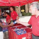 Lon Kaufman gets a bottle of water during move-in