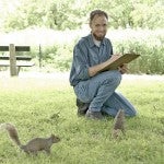 Steve Sullivan observes two squirrels in Lincoln Park