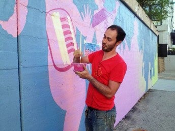 Nick Goettling painting mural