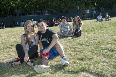 Couples sitting in the grass