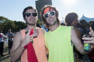 Male students giving the peace sign