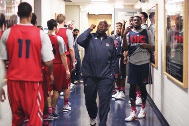 Coach Howard Moore pumps up his team