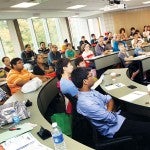 visitors listening to a presentation