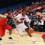 Kelsey Barlow goes between defenders