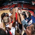 Team huddles up before their game versus Roosevelt