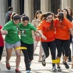 Pairs competing in a 3-legged race