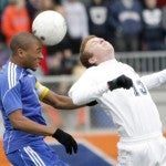 Nathan Laude heads the ball