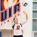 Nicole Johnson sets the ball for teammate Sara Jo Sternard