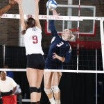 Kara Johnson jumps to spike the ball