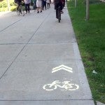 bike lane marker on the sidewalk