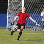 Kelly Fritz kicks the ball away from her own goal