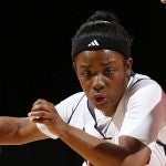 Terri Bender fighting off a defender