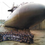Shane Murphy and Navy members in front of a submarine