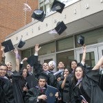 students toss their hats in the air