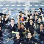 UIC College of Nursing seniors jump in the pool to celebrate graduation