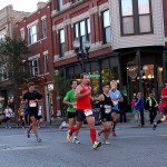 Chicago Marathon participants running down Taylor Street