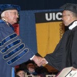 President Bob Easter congratulates 2014 honorary degree recipient Shing-Tung Yau