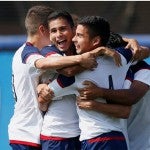 UIC men's soccer players celebrate win