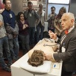 George Kondos demonstrates a cardiovascular physical exam on Harvey, a life-size mannequin.