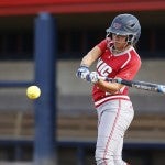 softball player taking a swing