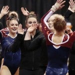 women's gymnastics team celebrating