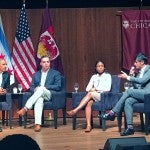 Former president Barack Obama and panel on stage