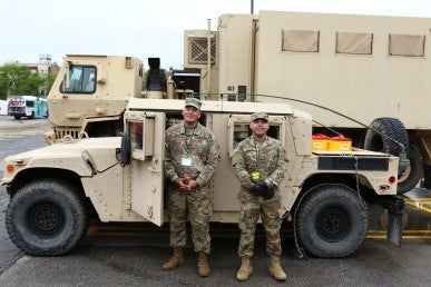 US Army Reserve members outside their Humvee