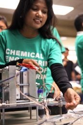 chemical engineering student giving a demonstration