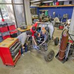 Engineering students working on a vehicle