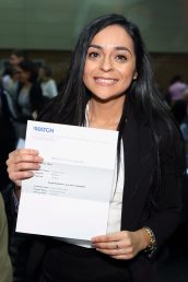 woman holding up her match letter