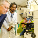 Michael Caffrey, graduate student Nitin Jayakumar, and Igor Paprotny work in the Nanofabrication Lab.