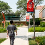 Person walking on west campus. Photo by Martin Hernandez/UIC