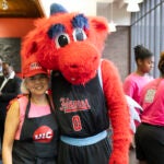 Chancellor Miranda poses with Sparky during the East Campus Ice Cream Social. Photo by Jenny Fontaine/UIC