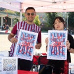 Students with UIC Student Leadership and Civic Engagement handing out voting information at the east side of campus Sept. 17, 2024. (Jenny Fontaine / UIC)