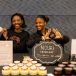 two women show their skincare line at the Marketplace event