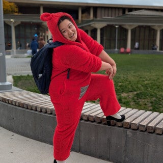 UIC students, staff and faculty celebrated Halloween in style, dressing up as everything from an avocado to a suffragette. (Photo: Jenny Fontaine/UIC) A woman poses in a red Halloween costume