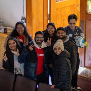 For the 2025 MLK Jr. Day of Service, UIC students cleaned and picked up trash at Stone Temple Baptist Church in Lawndale. (Photo: Creative and Digital Services) A group of students pose together wearing heavy winter jackets.