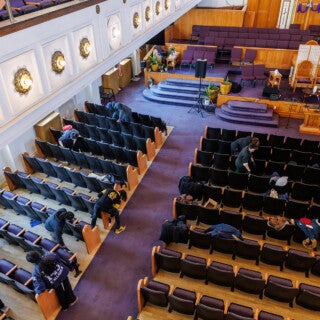 For the 2025 MLK Jr. Day of Service, UIC students cleaned and picked up trash at Stone Temple Baptist Church in Lawndale. (Photo: Creative and Digital Services) students clean chairs at a church