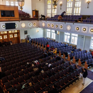 For the 2025 MLK Jr. Day of Service, UIC students cleaned and picked up trash at Stone Temple Baptist Church in Lawndale. (Photo: Creative and Digital Services) A wide view of a church shows students working on cleaning